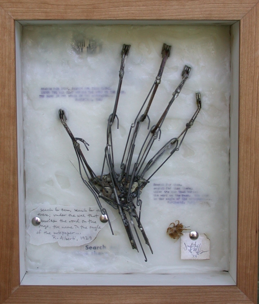 Original mixed media artwork by Judith Ann Miller, features a life-size replica of the artist's hand made out of typewriter keys, beeswax and a carpenter bee